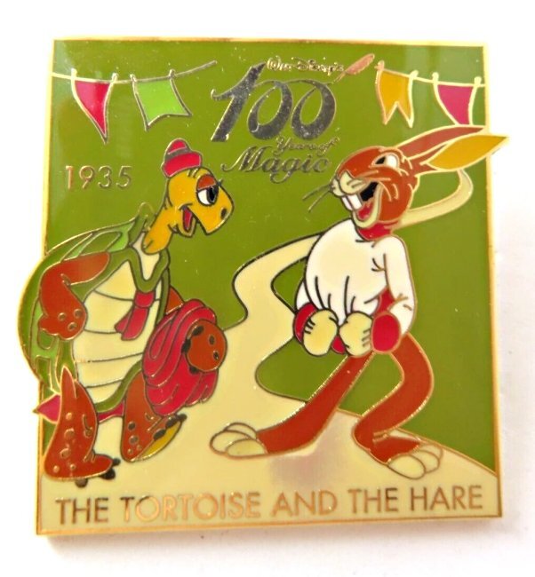 A square green pin with a tortoise and a hare.