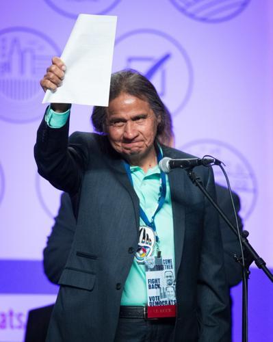 Frank LaMere waves to the crowd