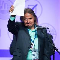 Frank LaMere waves to the crowd
